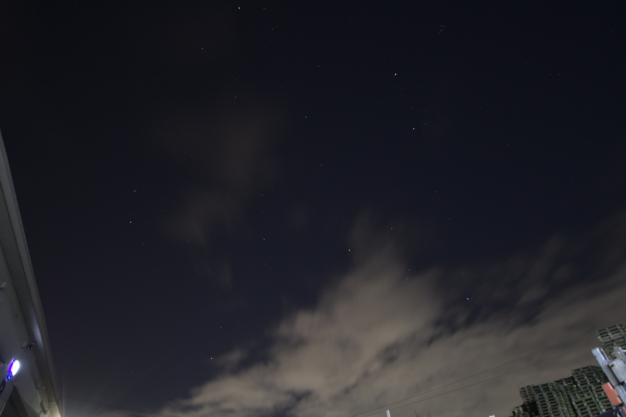 Nighttime photograph of the navy-blue sky speckled with stars.