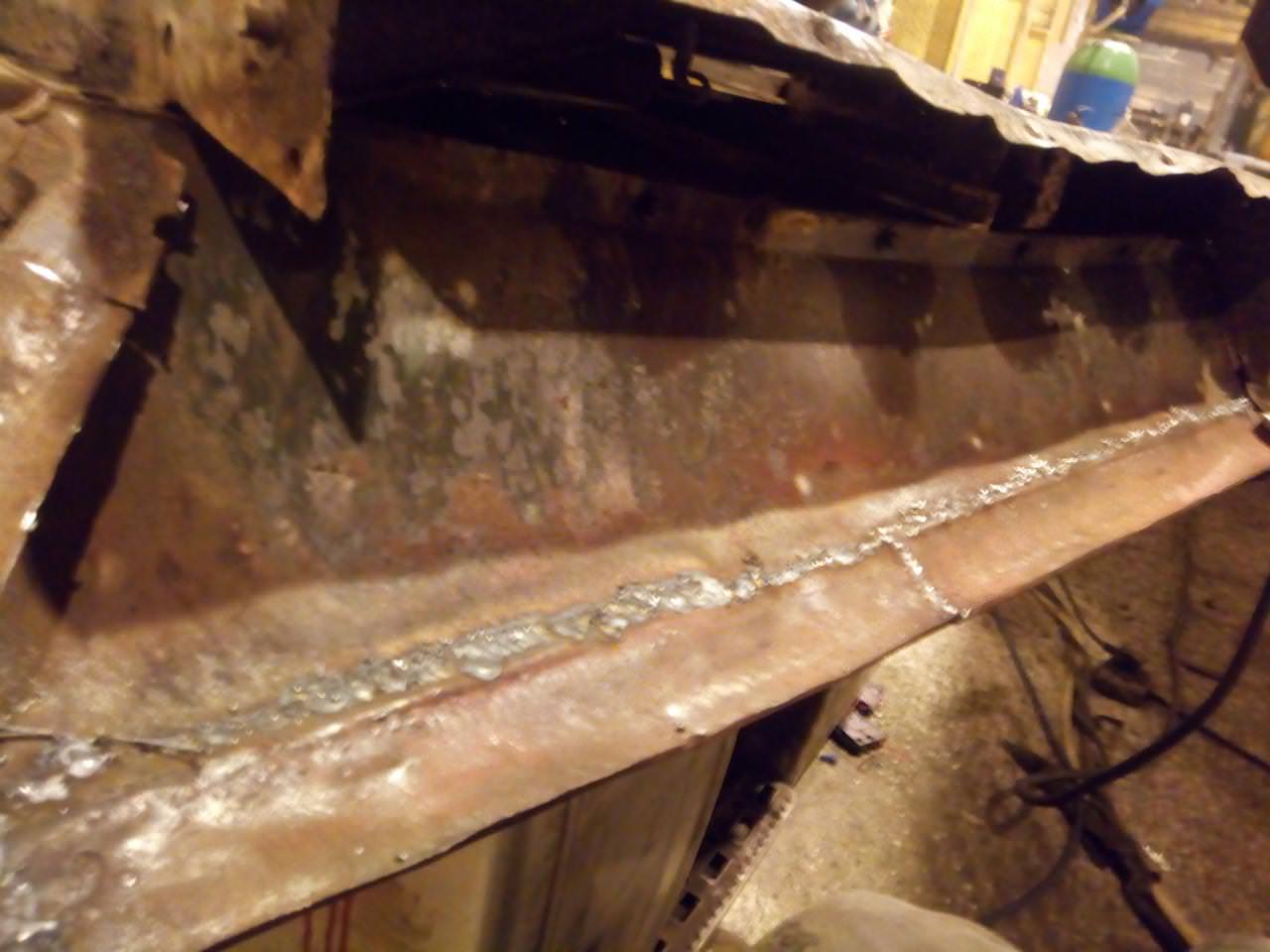 The bottom edge of the driver's door, with somewhat-crudely
welded replacement lower edges