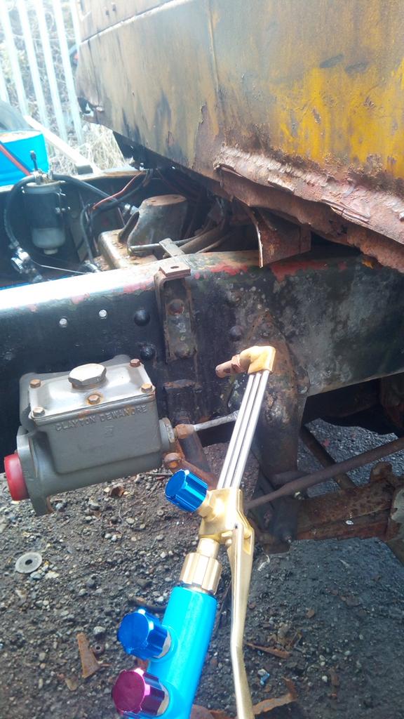 an oxy-fuel cutting torch being held up menacingly at the back of
the truck's cab.