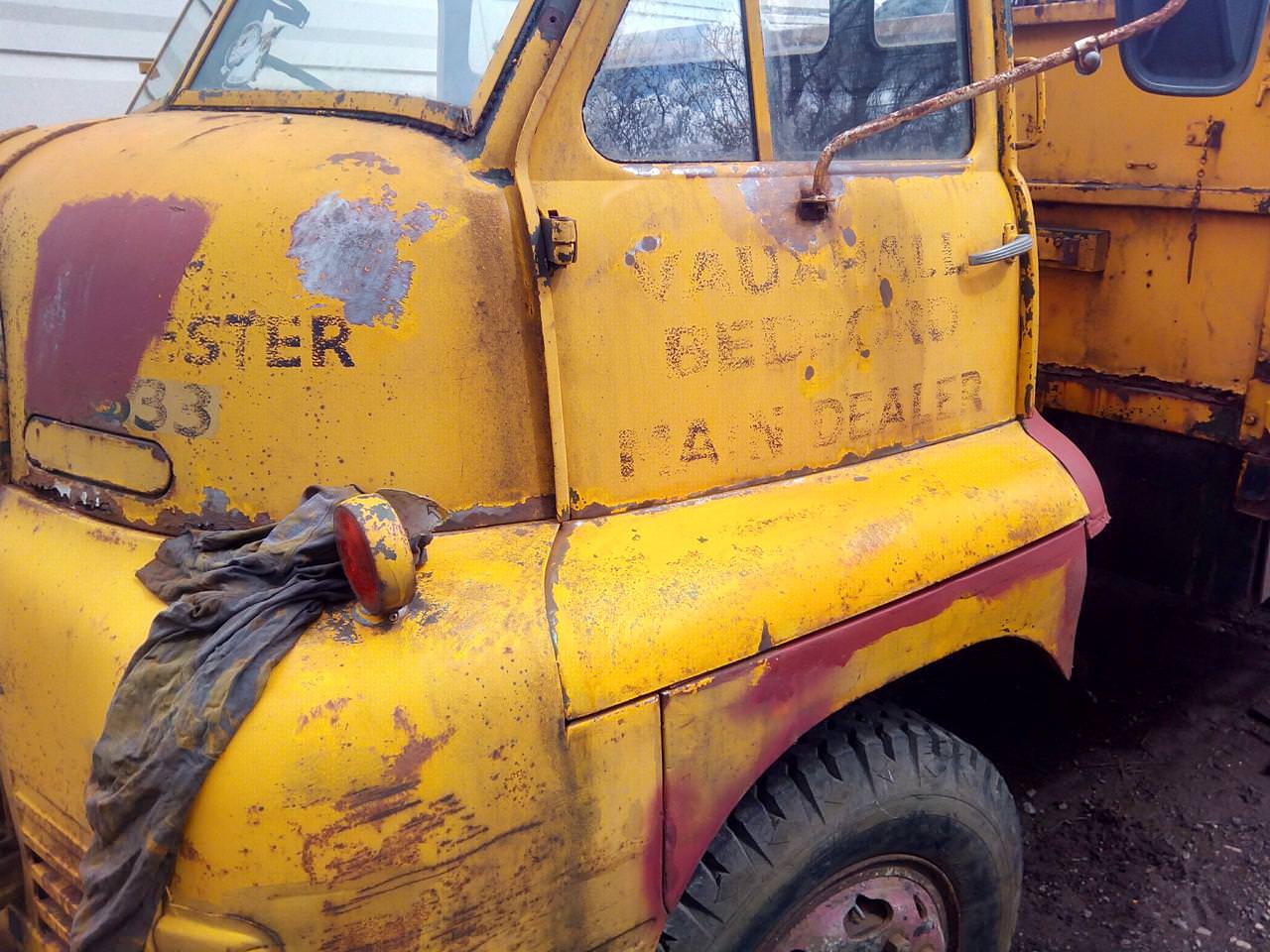 The passenger side of the truck's cab, with the
bottom of the door looking a much more vibrant yellow than the rest of
the cab.