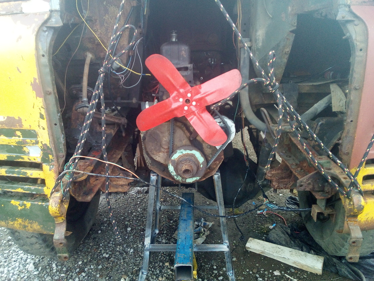 The front of the truck, with the engine completely supported on
the cradle and the front crossmember extracted completely.