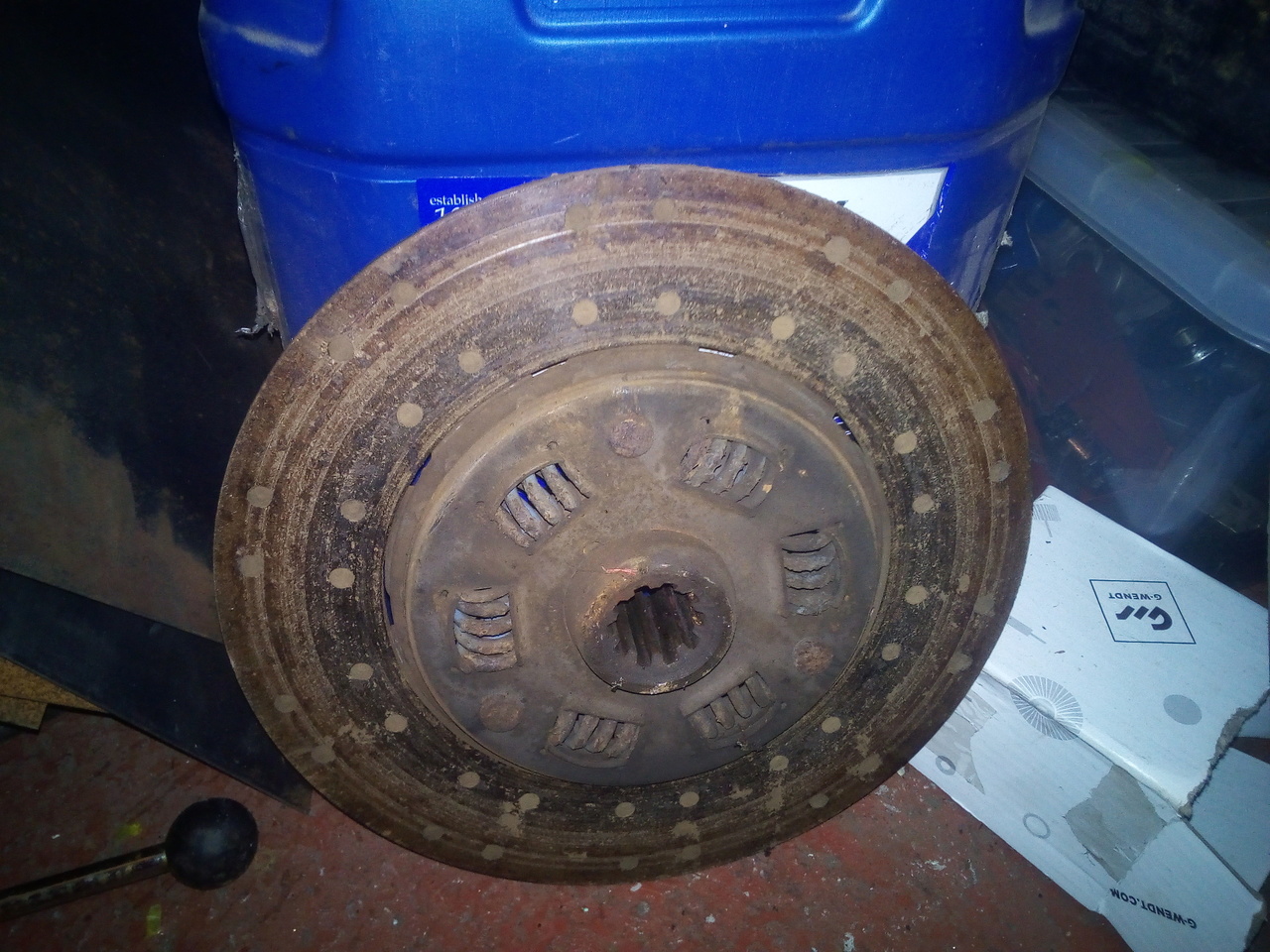 The clutch friction disc leant up against an oil drum. It is
quite heavily used.
