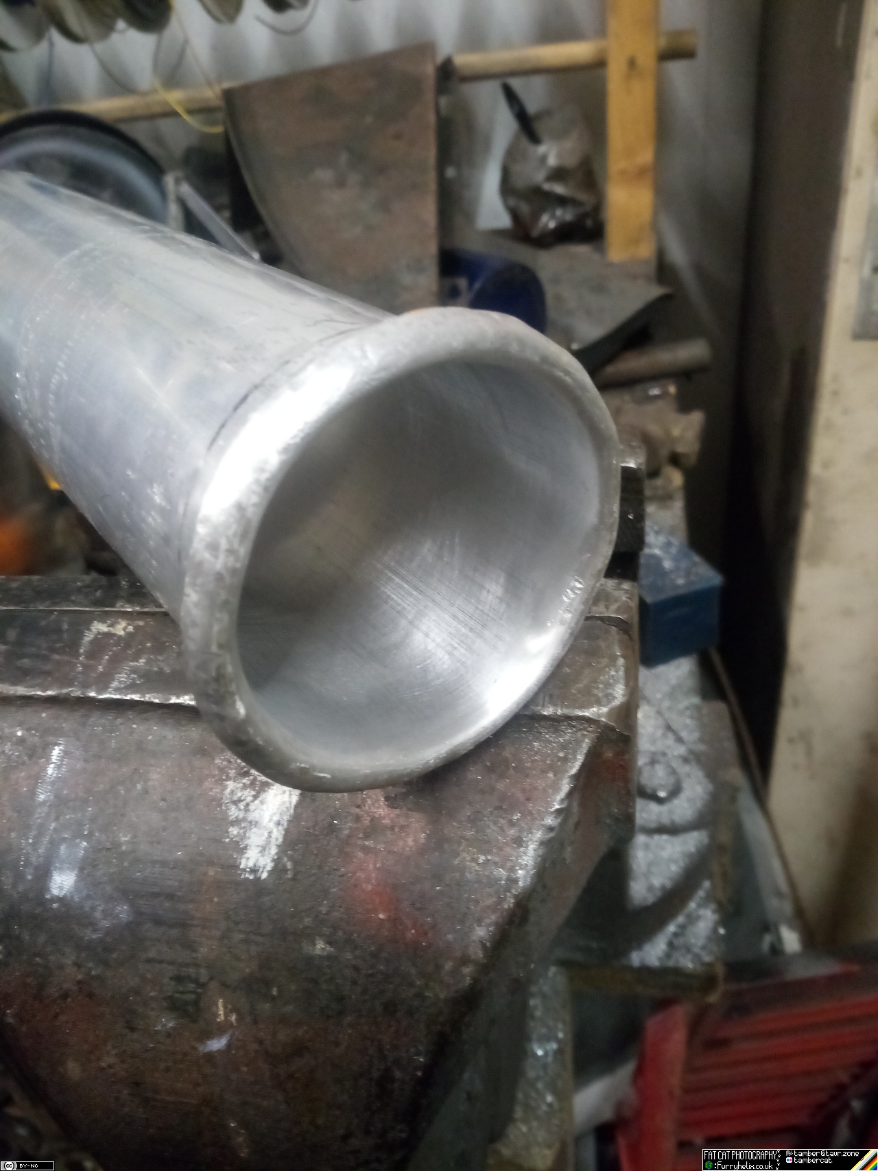 Aluminium tube with the end rolled over to provide a smooth edge