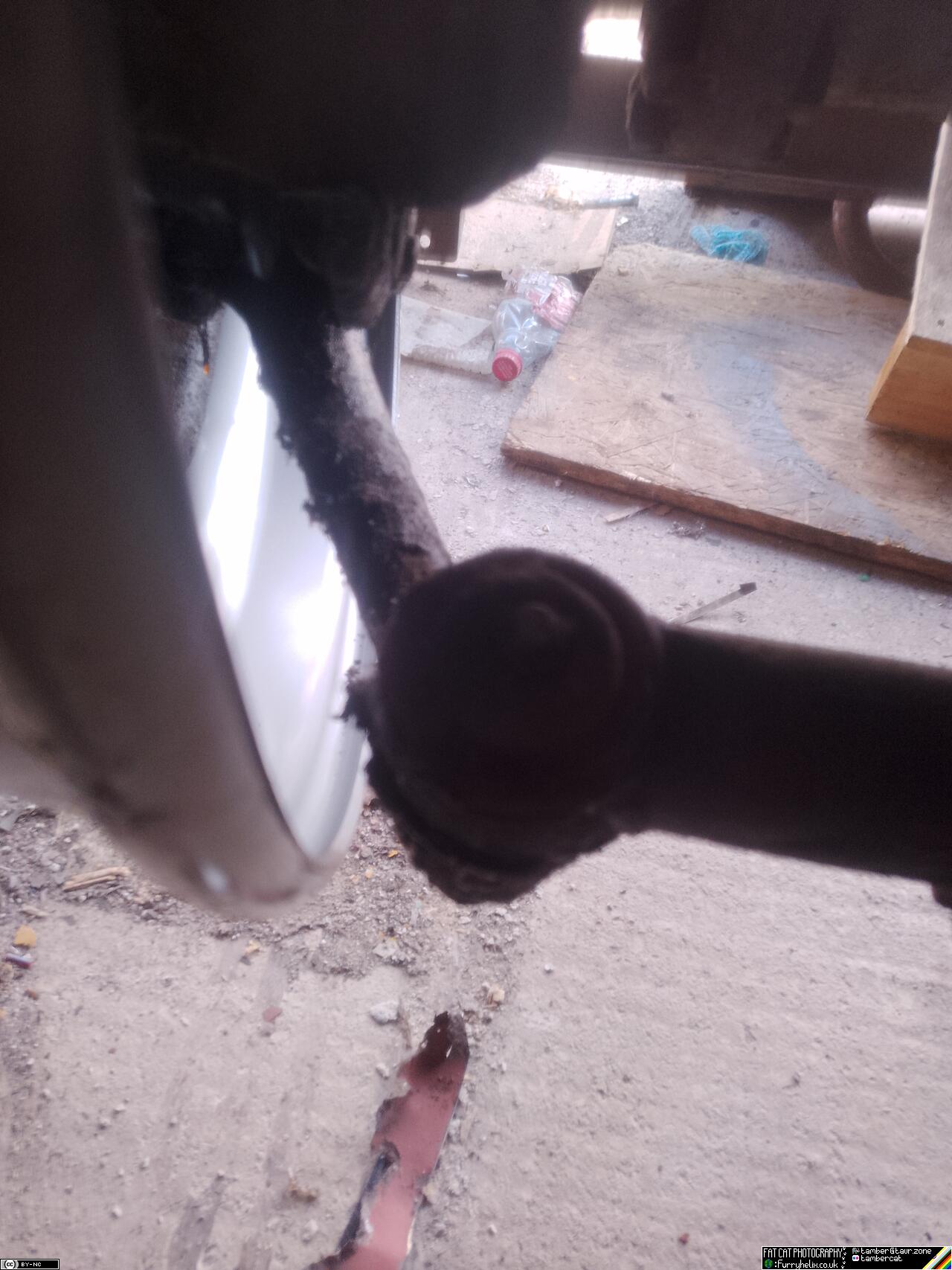 Close up of the steering track-rod end, showing a healthy clearance to the rim of the new wheel
