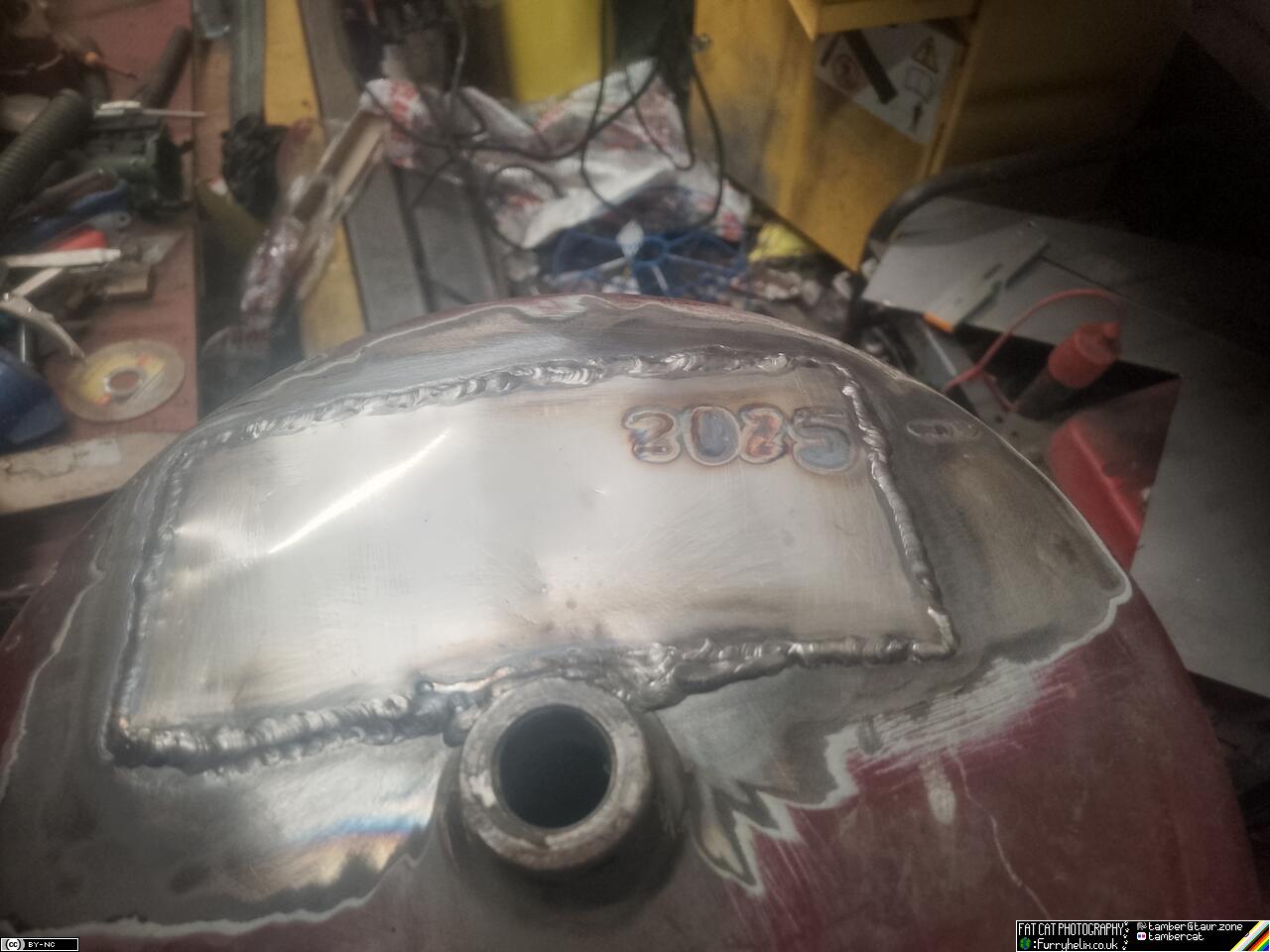 End of the air tank, with a patch welded over the repaired cracks. The year 2025 has been 'inscribed' with welding marks