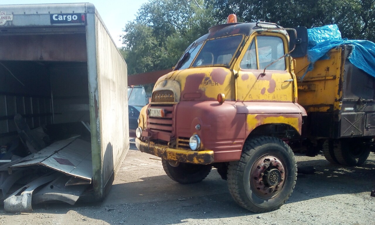 "Box-truck body being pushed out of the way by the Bedford"