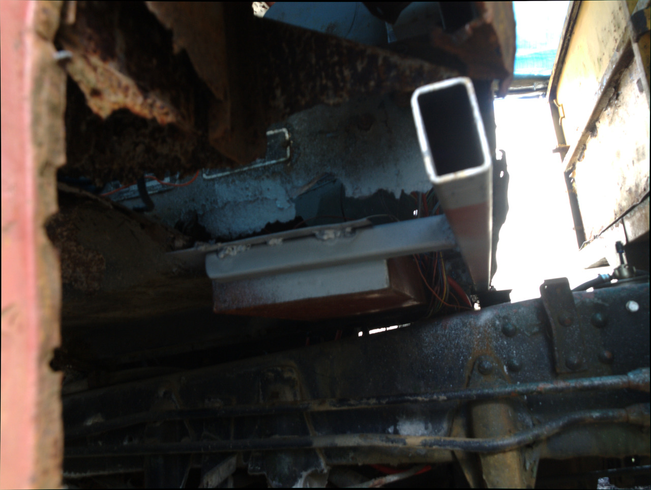 Looking up under the rear passenger's side of the cab, showing a
new brace added to the battery box to tie it into the new cab
crossmember.