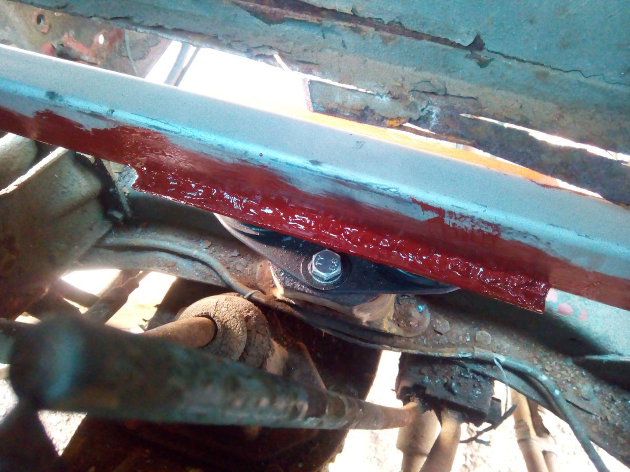 The rear cab mount viewed from the inside of the cab, fully
welded along the length of the bracket, and painted with red primer.